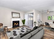 Thumbnail 3 of 57 - Living area with fireplace and sliding glass doors to balcony at Pointe Niguel, Laguna Niguel, CA