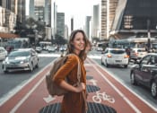 Thumbnail 22 of 24 - portrait of a young woman standing in the middle of a city street at NoMa Apartments, California, 94596