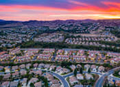 Thumbnail 60 of 62 - aerial view of capriana apartments and chino hill neighborhood at sunset at Capriana at Chino Hills, Chino Hills