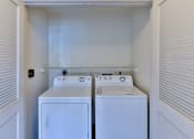 Thumbnail 36 of 62 - laundry closet with washer and dryer at Capriana at Chino Hills, California