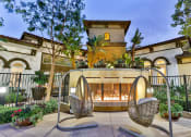 Thumbnail 12 of 62 - capriana fireplace lounge and hammock chairs at Capriana at Chino Hills, Chino Hills, CA, 91709