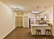 Thumbnail 52 of 62 - furnished kitchen with grey cabinets at Capriana at Chino Hills, California