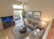 Thumbnail 26 of 46 - Living room with large patio door and ceiling fan