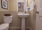 Thumbnail 43 of 46 - bathroom with a toilet sink and mirror