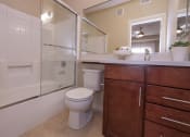 Thumbnail 40 of 46 - a bathroom with a toilet sink and shower