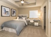 Thumbnail 34 of 46 - bedroom with ceiling fan, window and closet