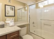 Thumbnail 41 of 46 - a bathroom with a shower toilet and sink