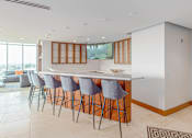Thumbnail 13 of 127 - Kitchen with a Bar Area at Casa Estilo Apartments, California, 91910