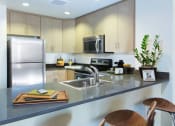 Thumbnail 12 of 51 - Kitchen with stainless steel appliances at Venue, San Francisco, 94158