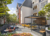 Thumbnail 54 of 83 - Outdoor Courtyard With BBQ Grill Area, Firepit, Tables And Chairs at Bayswater Apartments, Burlingame, 94010