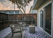 Thumbnail 4 of 27 - A patio with a table and chairs at Nola 624 Apartments, West Covina, CA, 91790