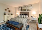 Thumbnail 15 of 27 - A bedroom with a bed, nightstands, and a rug at Nola 624 Apartments, California