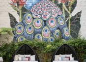 Thumbnail 4 of 39 - a mural of a peacock on the side of a building with lounge seating by the pool at Vera Cortez Hill, San Diego, CA