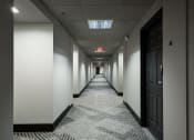 Thumbnail 36 of 39 - Hallway to apartment units at Vera Cortez Hill, San Diego, California