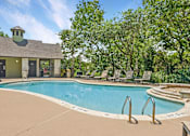 Thumbnail 10 of 40 - A pool with lounge seating