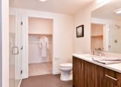 Thumbnail 28 of 33 - a bathroom with a toilet and a shower and a sink