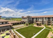 Thumbnail 2 of 39 - Courtyard with Manicured Lawn, Benches, and Gazeebo at Terracina, Broomfield, CO 80020