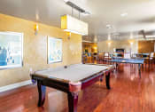 Thumbnail 10 of 75 - a game room with a pool table and ping pong