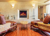 Thumbnail 11 of 75 - Clubroom with a fireplace and leather furniture