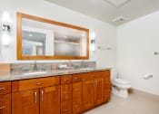 Thumbnail 17 of 75 - a bathroom with a large vanity and a toilet