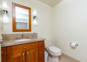 Thumbnail 20 of 75 - a bathroom with a toilet sink and mirror