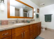 Thumbnail 29 of 75 - a bathroom with a large vanity and a toilet