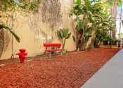 Thumbnail 50 of 75 - Pet friendly amenity with red bench and fire hydrant