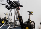 Thumbnail 40 of 75 - a group of exercise bikes in a gym