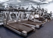 Thumbnail 42 of 75 - a row of treadmills and other exercise equipment in a gym