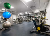 Thumbnail 43 of 75 - a gym with weights and other exercise equipment in a building
