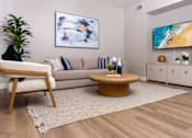 Thumbnail 42 of 98 - a living room with a couch and a table