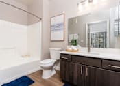 Thumbnail 58 of 98 - the preserve at ballantyne commons apartment bathroom with tub and toilet