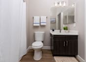 Thumbnail 57 of 98 - a bathroom with a toilet and a sink