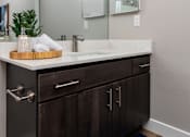 Thumbnail 53 of 98 - the retreat apartments renovated bathroom with counter top and mirror
