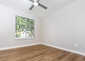 Thumbnail 70 of 98 - Apartments in Spring Valley, NV, for Rent - Alicante - Bedroom with Hardwood-Style Floor, Spacious Closet, and Large Window with Blinds