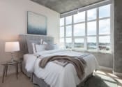 Thumbnail 24 of 29 - Two Bedroom Apartments in Oakland CA - Aqua Via - Bedroom with Plush Carpeting and a Large Window for Maximum Sunlight at Aqua Via Apartments, Oakland