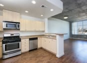 Thumbnail 29 of 29 - kitchen with stainless steel appliances at Aqua Via Apartments, Oakland, 94607