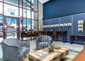 Thumbnail 6 of 29 - furnished lobby and entry way with lounge seating at Aqua Via Apartments, Oakland, 94607