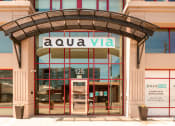 Thumbnail 2 of 29 - Aqua via entry way with property sign at Aqua Via Apartments, Oakland, CA, 94607