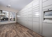 Thumbnail 50 of 57 - A row of white lockers are lined up in a room with wood flooring.