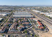 Thumbnail 51 of 57 - A large aerial view of a commercial area with buildings and roads.