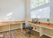 Thumbnail 27 of 29 - A room with a desk and a computer monitor.