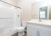 Thumbnail 32 of 60 - a bathroom with a shower toilet and sink