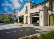 Thumbnail 2 of 60 - a building with a parking lot in front of it