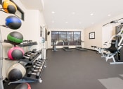 Thumbnail 9 of 60 - gym with free weights, weight machine, and cardio equipment