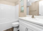 Thumbnail 30 of 60 - a bathroom with a sink toilet and bathtub