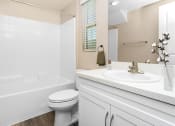 Thumbnail 35 of 60 - a bathroom with a sink toilet and bathtub