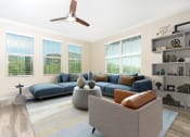 Thumbnail 19 of 60 - a living room with four windows and a ceiling fan