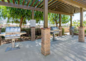 Thumbnail 76 of 83 - A row of benches are lined up under a roof.