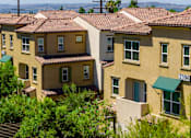 Thumbnail 81 of 83 - A row of houses with green awnings and numbers on the front.